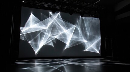 Poster - Geometric lighting patterns projected onto a dark stage, forming an abstract and modern design.