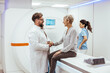 © Dragana Gordic - Doctor Consulting Elderly Patient During MRI Scan in a Medical Facility