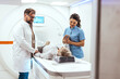© Dragana Gordic - Medical Professionals Assisting Patient During MRI Scan Session