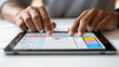 © saichon - Designing mobile app interface with hands on tablet screen