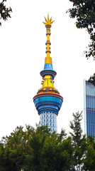 Poster - Dragon Tower rising against transparent backdrop, revealing colorful architectural details surrounded by verdant landscape