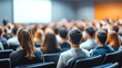 © sergign - A diverse audience focuses intently on a speaker during a conference, symbolizing the engaging nature of presentations and the importance of effective communication.