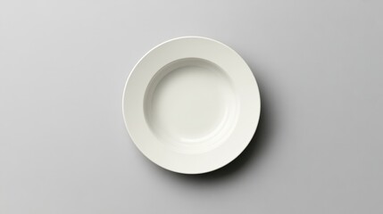 Poster - Elegant Creamy White Soup Plate on a Soft Grey Background Minimalist Top View Studio Shot for Culinary Presentation