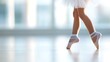 © DIAHIMAGESNEW - Young ballerina's pointe-shoe feet gracefully performing a ballet dance routine in a studio