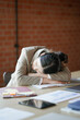 © mojo_cp - Tired asian business woman overworking and Sleep at work