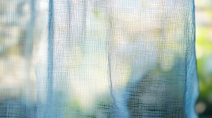 Poster - Soft, Ethereal Texture of Sheer Fabric Draped Gracefully Against a Natural Outdoor Background, Capturing Light and Creating a Dreamy Atmosphere