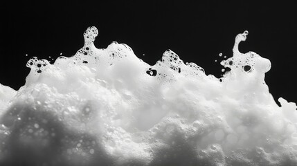 Poster - Detailed Close-Up of White Foam Bubbles on a Dark Background, Creating an Abstract and Artistic Textural Effect in High Contrast Black and White