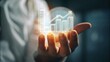 © ngstock - Close-up of a Business Hand Gently Holding an Innovative Graphic of Growing Data and Financial Trends for Success