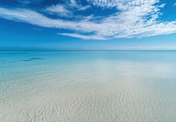 Poster - Tranquil Tropical Seascape Under Bright Blue Sky with Gentle Waves and Soft Cloud Patterns on Serene Beach Shoreline