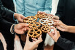 © InfiniteFlow - Group of multiracial business people joining gear wheels together as effective unity and productive teamwork concept. Efficient system business team process for solution solving. Meticulous