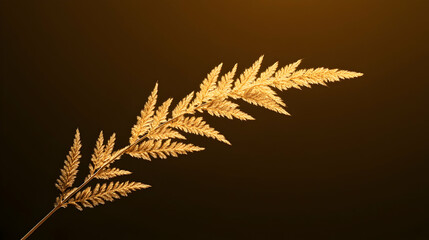 Wall Mural - a delicate golden fern leaf elegantly displayed against a warm, dark background. this close-up captu