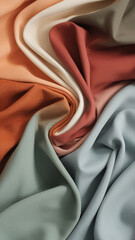 Aufkleber - Close-up of colorful fabric in a soft swirl, featuring orange, green, white, and beige tones, highlighting the texture and flow of the textile, representing harmony and elegance.