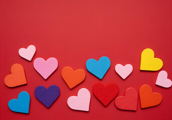 Wall Mural - Colorful handmade hearts on a vibrant red background.