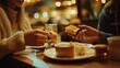 © พงษ์ศักดิ์ อ่อนพฤกษ์ - A couple sharing honey toast in a cozy cafe with hands reaching for a piece. The warm atmosphere, soft lighting, and perfectly arranged dessert create a moment of indulgence and joy.