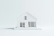 © BerkahStock - Minimalist white house model on white background.
