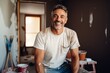 © Vorda Berge - Portrait of a middle aged Hispanic male plastering painter in the living room