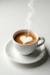 © napak - Aromatic Coffee with Heart-Shaped Latte Art in a White Cup on a Saucer