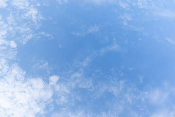 Wall Mural - beautiful blue sky and white fluffy group of clouds with sunrise in the morning, natural background