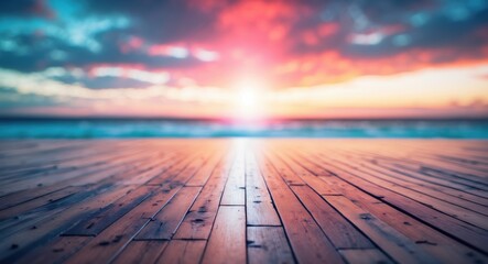 Poster - Abstract wooden floor perspective under a blurred beach sunset with gentle waves and vibrant sky colors, evoking tranquility and warmth.