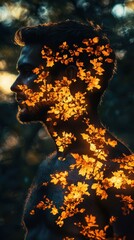Poster - Man illuminated with glowing autumn leaves in a tranquil natural setting during twilight hours