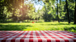 © Atchariya63 - red and white checkered tablecloth on sunny day in green park, creating cheerful atmosphere