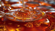 © Vasili - Amber honey splash frozen in time showing droplet impact on golden liquid surface. The high-speed macro photograph captures perfect viscous texture and natural sweetener movement