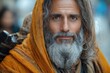 © Fotograf - Portrait of an old man with a long white beard and a bright yellow robe, possibly a monk or a wizard