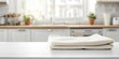 © DINH - Fresh Towel on Kitchen Countertop with Modern White Cabinet Background