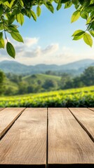 Poster - A wooden table sits in the foreground, showcasing lush green leaves framing a stunning valley. Rolling hills extend into the distance under a clear blue sky, creating a peaceful retreat atmosphere
