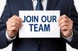 © SR Creative Idea - Businessperson Holding Sign Join Our Team Recruitment Hiring Employment