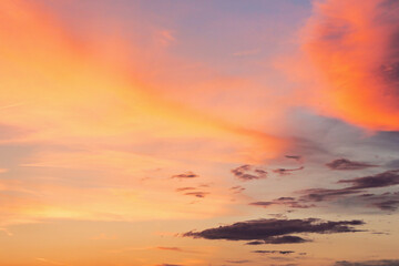 Wall Mural - changing weather forecast. sunny heaven. red clouds on the bue evening sky. dramatic sunset backgrou