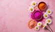 © Arnab Dey - Colorful Holi Festival Decorations with Vibrant Powders and Flowers on Magenta Background