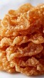 © rashyn - Crispy fried pork skin pile, light background, likely for food ads