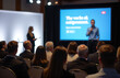 © fotoluigi868 - A Female Speaker Delivers A Presentation To An Audience Of Unrecognizable Attendees At A Corporate Business And Entrepreneurship Conference Event.