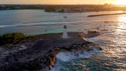Wall Mural - aerial sunset view of the nassau harbour lighthouse on paradise island, new providence, bahamas, car