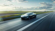 © Artinun - Modern electric sports car drives fast on an open road. Speed, innovation, and futuristic automotive design. Luxury mobility, and perfect fusion of power, efficiency, and eco-conscious transportation.
