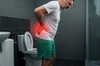 © ArtFocus Studio - Man Experiencing Lower Back Pain in Bathroom: Health Issue, Treatment, and Care