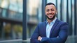 © Visual Craft - A confident, smiling Arabic businessman in a formal jacket, looking directly at the camera for his corporate profile.