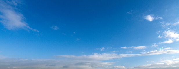 Wall Mural - clear blue sky with a few clouds