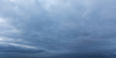 Wall Mural - gentle and soft clouds covering dark sky. background photo texture