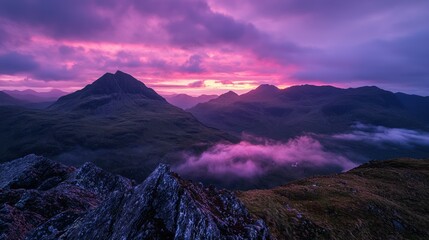 Poster - A mountain range glowing under a deep purple sunset, with mist rising from the valleys.