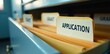© James - Close-up of application and grant folder labels on a filing cabinet, neat, cabinet, professional