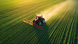 © Govan - Aerial photography of a large agricultural sprinkler working on a green field