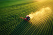 © Govan - Aerial photography of a large agricultural sprinkler working on a green field