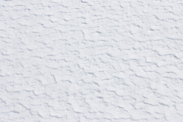 Wall Mural - natural textured pattern on white winter snow surface background
