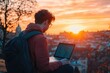 © Serhii - Nerd Student Embracing Freedom: Outdoor Programming at Sunset with Laptop, Connecting to New Opportunities Everywhere