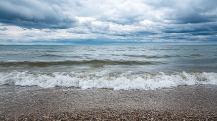 Fototapete - Lonely seashore with gentle waves and overcast sky invites reflection and tranquility in a serene coastal setting Generative AI