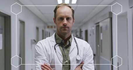Poster - Image of white frame over caucasian male doctor in hospital