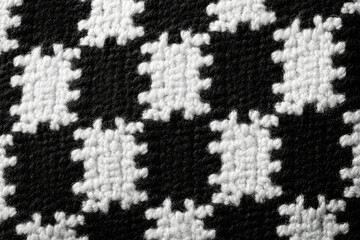 Poster - Close-up of a black and white houndstooth pattern woven fabric texture.