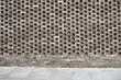 © yaqui_villegas - Modern perforated brick wall with geometric pattern and urban design.